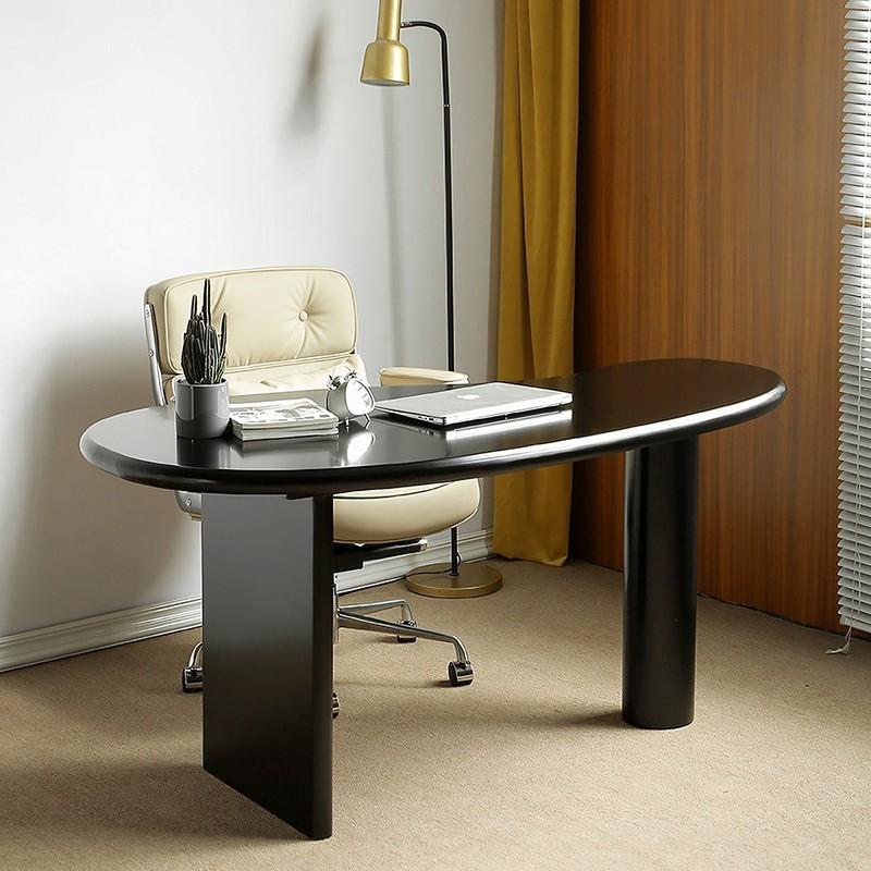 5. Mid-Century Inspired Workspace with an Oval Black Desk (مدل میز کار مشکی)